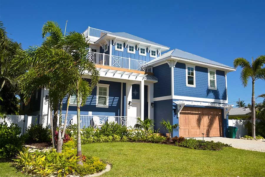 blue home and front lawn orlando fl